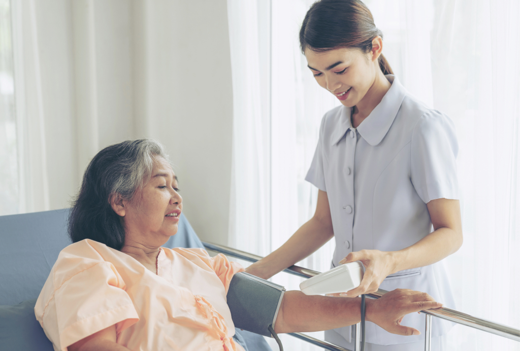 An SM24 nurse caring for a resident